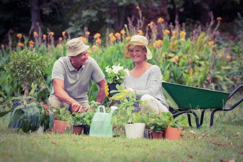 Gardener working in a Golders Green front garden