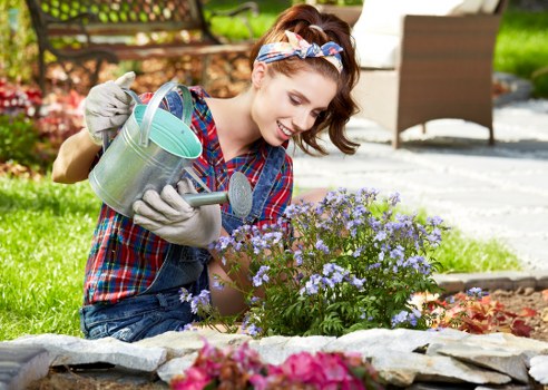 Gardener measuring a garden for a free quote